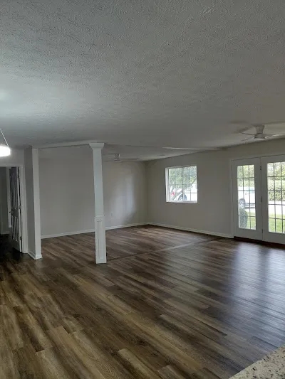 Our drywall experts showcase a freshly finished open interior with smooth walls, clean ceilings, and seamless trim, highlighting our professional drywall installation service in Shelbyville.