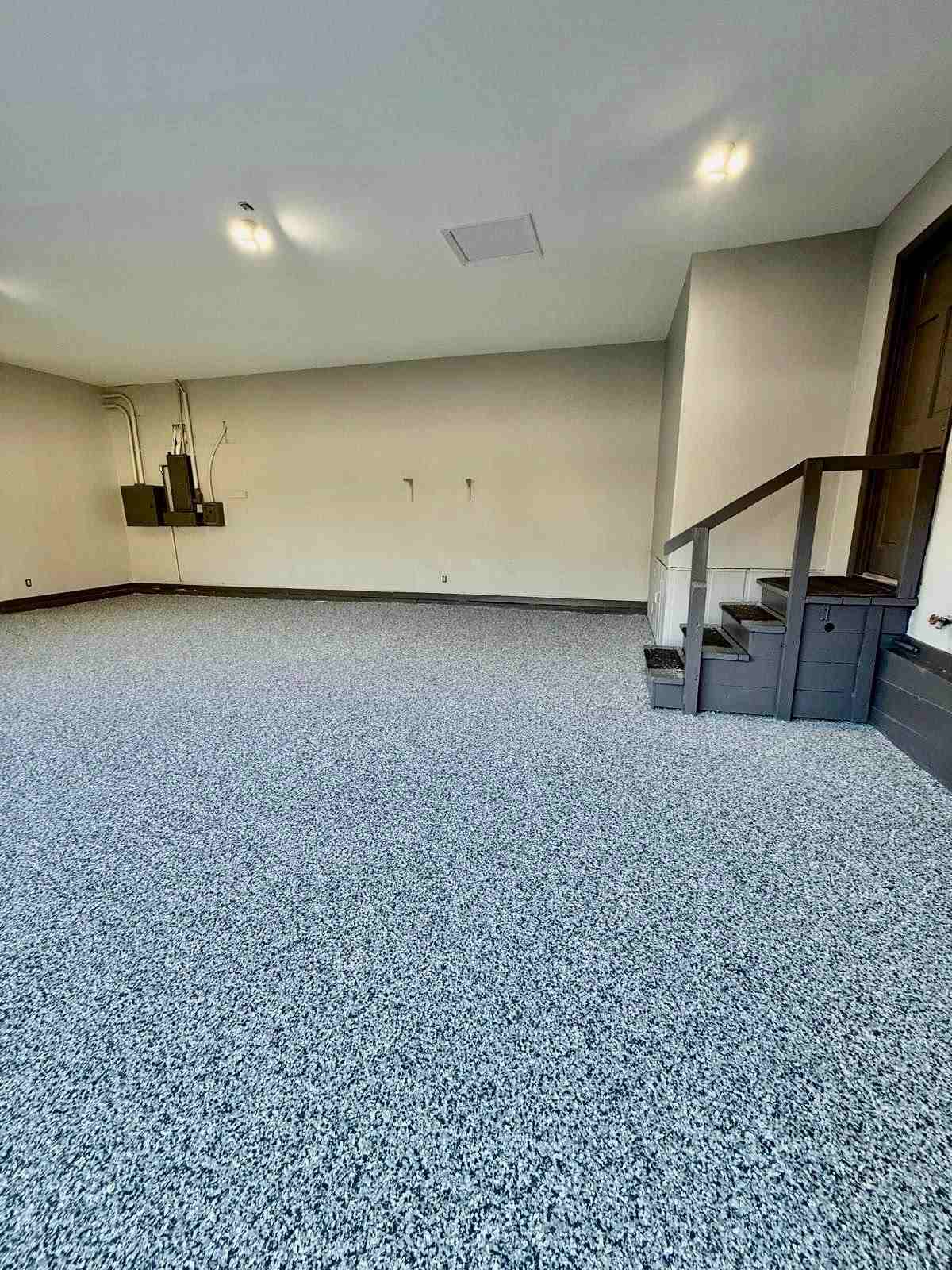 Fresh epoxy floor coating applied by our crew in a Shelbyville, KY basement, leaving a smooth, glossy, durable finish.